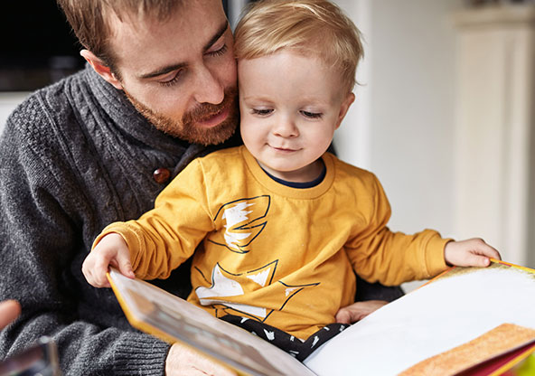 Boy and dad reading