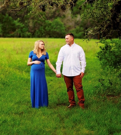 Man and woman standing in a field