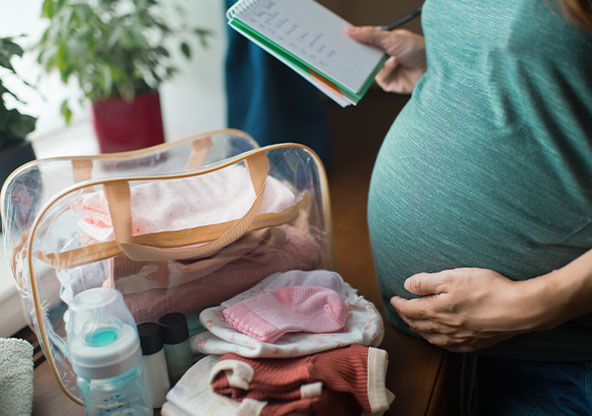 Pregnant mom packing hospital bag