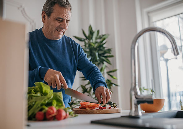 Man cutting vegetables