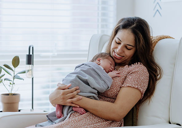 Mother receives postpartum resources and supports her newborn child. 